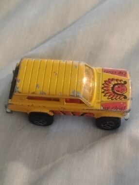 Yellow Die-Cast Toy Jeep Charokee with 'Big Chief' Hood Graphic